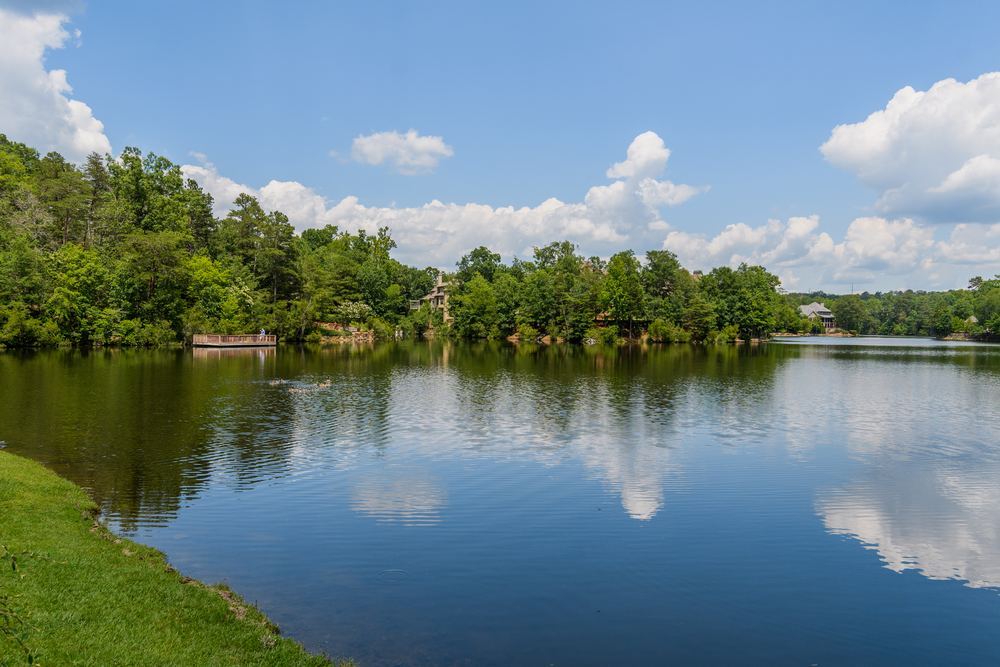A lake in Vestlake with trees along the far shore