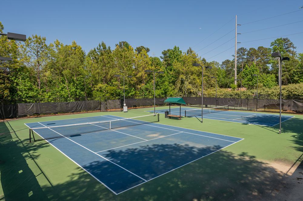 Tennis courts under a blue sky