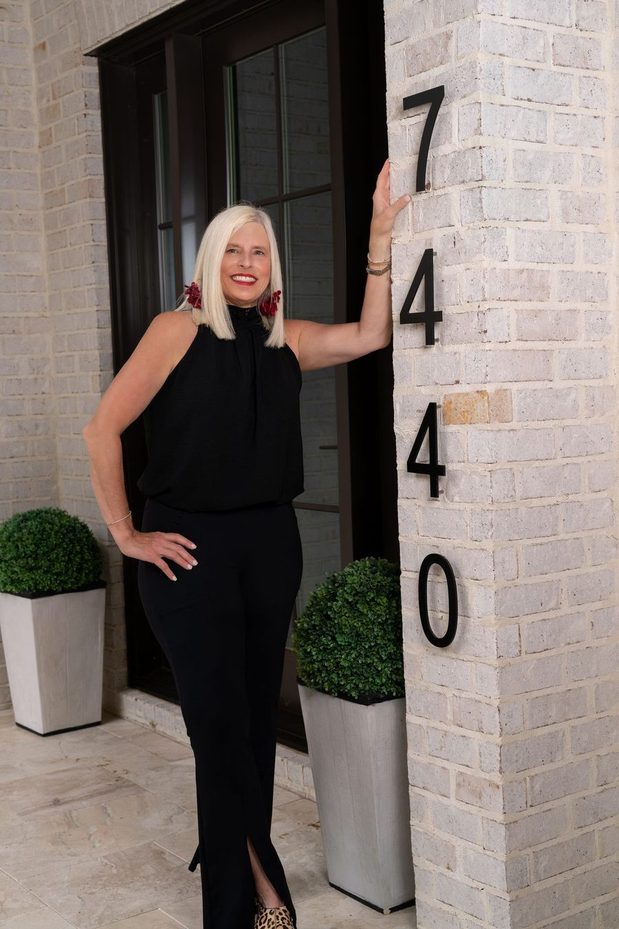 Michelle Creamer standing beside a front door